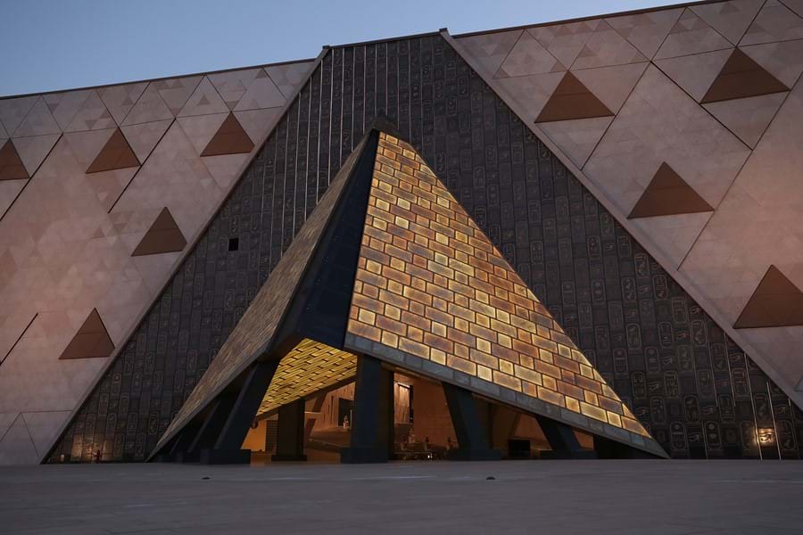 The museum's translucent alabaster entrance lit up at dusk